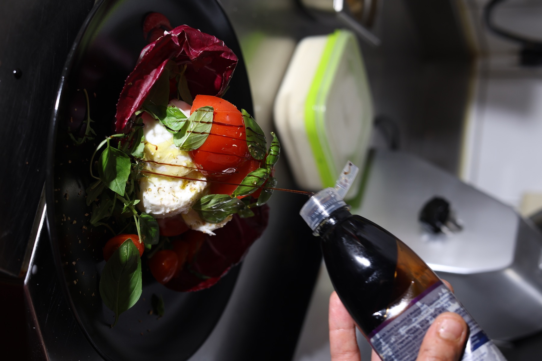 Balsamic glaze finishing a fresh Gondelfahrt plate